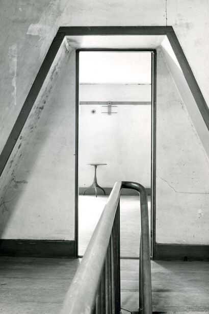 Second Dwelling House, view through door with railing, candle stand, and double clothes hanger (North Family, Mount Lebanon, New York)
