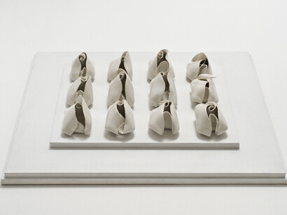 Hannah Wilke, Untitled, 1977, 12 white glazed porcelain ceramics on painted board
4.4 x 7 x 4.1 cm, 1 3/4 x 2 3/4 x 1 5/8 ins, each, 7 x 44.5 x 39.4 cm, 2 3/4 x 17 1/2 x 15 1/2 ins, board Unique. Courtesy Alison Jacques Gallery, London and Hannah Wilke Collection and Archive, Los Angeles. © Marsie, Emanuelle, Damon and Andrew Scharlatt, Hannah Wilke Collection & Archive, Los Angeles. Licensed by VAGA, New York, NY/ DACS, London.