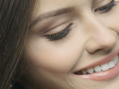 Woman with good oral hygiene showing her teeth