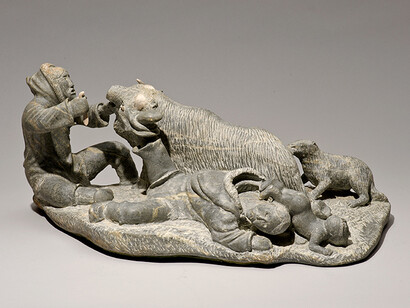 Lukie Airut (Igloolik, b. 1942) Woman with Boot Caught on Muskox Horn, 1982. Stone, antler. Collection of the Winnipeg Art Gallery. Gift from the Collection of George and Tannis Richardson, 2011-54Photo: Ernest Mayer, Winnipeg Art Gallery