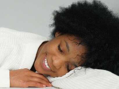 Woman smiling while dreaming