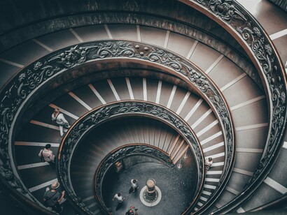 The elegant spiral staircase of the Vatican Museums in Vatican City, symbolising intuitive navigation through uninterrupted spatial design