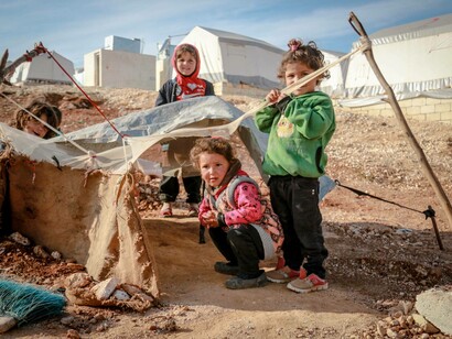 Several small children in a Syrian refugee camp