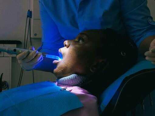 Dentist observing patient teeth 