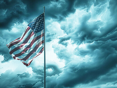 The storm clouds gathering behind the flag are a fitting backdrop for the 2025 Trump administration, one poised to push America toward an uncertain and deeply polarised future