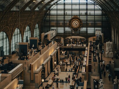 The iconic clock inside Musée d'Orsay in Paris, France, representing how institutions quietly govern people's relationship with time