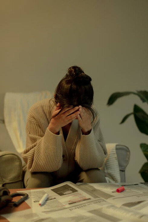 The emotional toll of job hunting is evident on this young woman's face, as she struggles with the deep sense of disappointment that comes from endless searching and no prospects