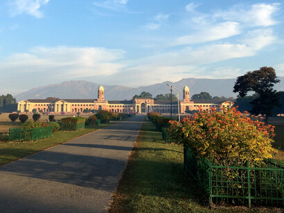 FRI building with Himalayan mountains in the background