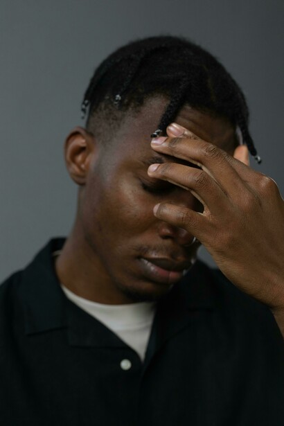 Close-up portrait of a distressed man in tears