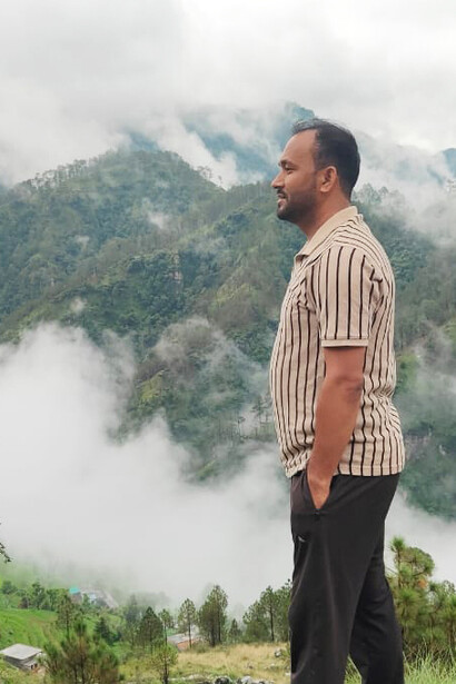 A quiet village in Kumaon, where everyday life flows gently beneath towering mountains and open skies