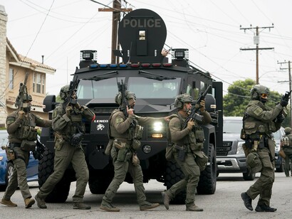 Paramilitary-style ICE units conduct raids that blur the line between law enforcement and intimidation