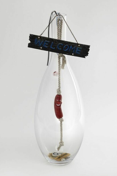 Jack Lavender, Welcome Into The Light 2013, Glass, welcome sign, metal, rope, plastic hot dog, apple shuffle, chains, dog key-ring, ear rings, plastic heart, plastic eye, 68x27x27 cm, 26.8x10.6x10.6 ins, AP-LAVEJ-00082