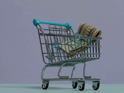 Cash in a cart representing a purchase in e-commerce