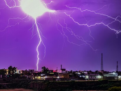 A large bolt of lightning struck a city, reflecting how unpredictable nature can be and the possibility that it left a lasting impact on the city's infrastructure
