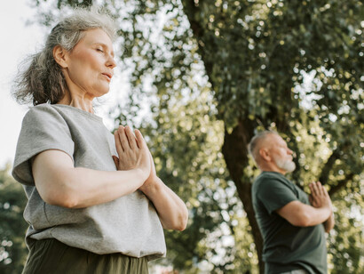 Close-up of a man and a woman practicing yoga