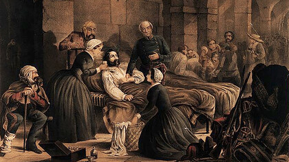 Florence Nightingale and her staff nursing a patient in the military hospital at Scutari. Coloured lithograph, c. 1855, by T. Packer 