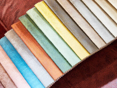 Selection of leather furniture upholstery samples, including eco-friendly fabrics and innovative vegan leather, perfect for creating a stylish and sustainable living space