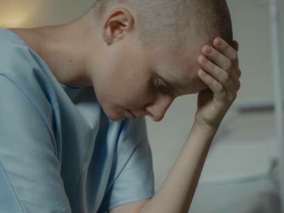 Patient holding her head