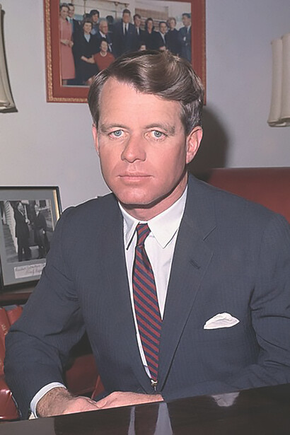 New York Senator Robert F. Kennedy seated at his desk in his Washington office, 1965