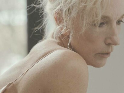 A woman ageing and feeling the effects 