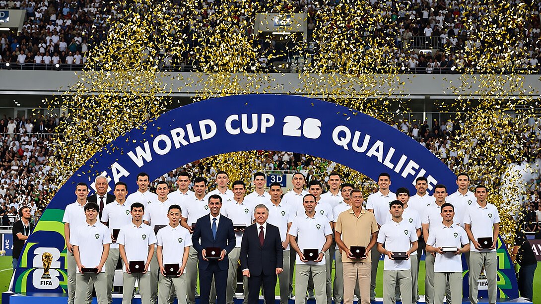 Uzbekistan’s national football team poses with the country’s president after the match against Qatar on June 10, 2025