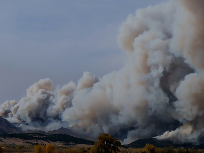 Captured on the day the fire ignited, this photo was taken from the highway, revealing the billowing smoke plume produced by the wildfire