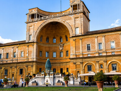 The Pinecone Courtyard, a prominent open-air space within the Vatican Museums in Vatican City, welcomes visitors at the start of their journey through the museum. Its spacious setting links several of the museums' corridors, halls, and exhibition areas