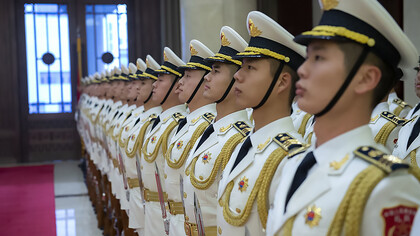 Chinese sailors stand in formation ahead of a visit by Chief of Naval Operations (CNO) Admiral John Richardson to the People's Liberation Army Navy (PLA(N)) headquarters in Beijing on January 14, 2019, China