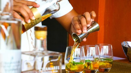 Bartender making drinks for patrons
