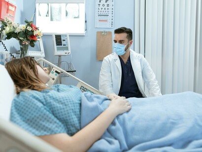 A doctor is engaging in a conversation with a patient about their medical concerns