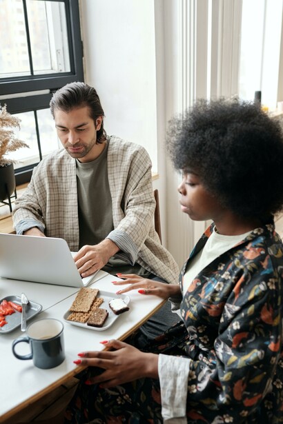 Two people having a coffee and a snack 