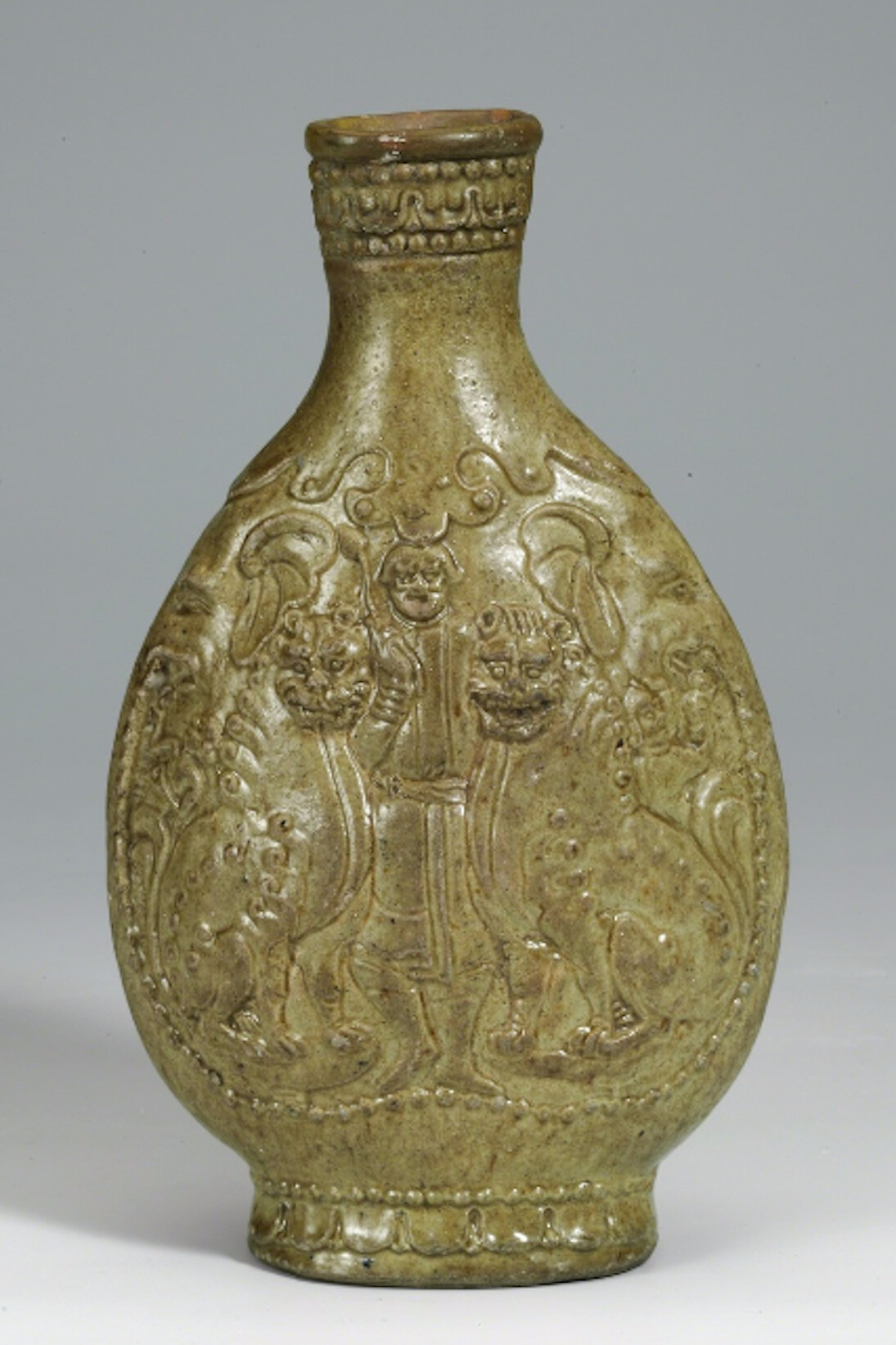 Unknown Artist, Yellow-green glazed flask with foreigner and lions, 550-577. Courtesy of China Institute Gallery