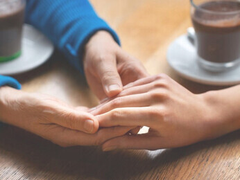 Supportive hands joined together, illustrating the principles of generosity, reciprocity, and the mutual acts of kindness in giving and receiving