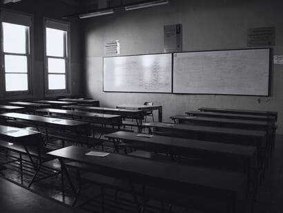 A quiet classroom without students, symbolising the fragile sense of safety within educational spaces