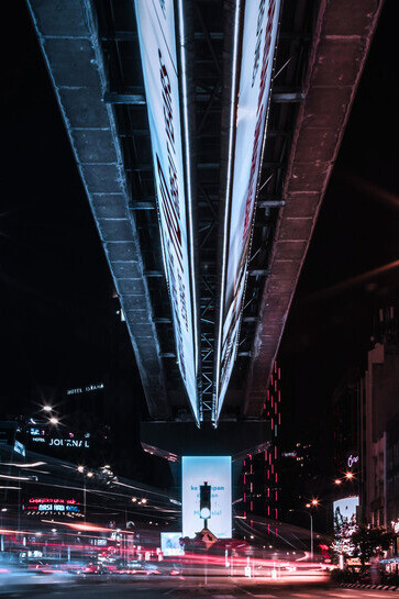A low-angle view of urban life at night in Kuala Lumpur, Malaysia