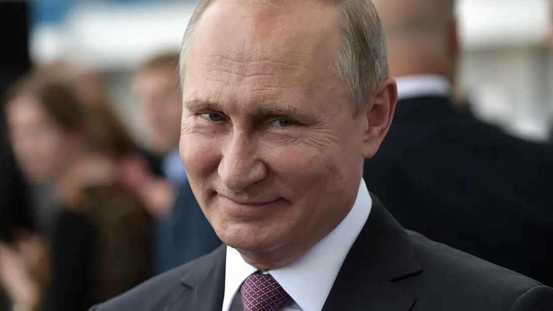 Russian President Vladimir Putin smiling even though he is at war with Ukraine