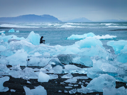 A photographer at the Jökulsárlón, Iceland glaciers
