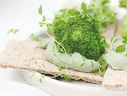 Green vegetable on white ceramic plate