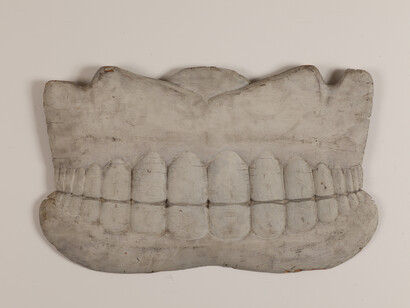 Dentist’s Trade Sign, Artist unidentified, New England, c. 1890, Paint on tulip poplar, 14 1/2 x 24 x 1". Photo courtesy of the Barbara L. Gordon Collection