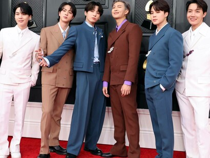 Some members of the male K-Pop group, BTS. smiling and having a great time at the Grammy Awards