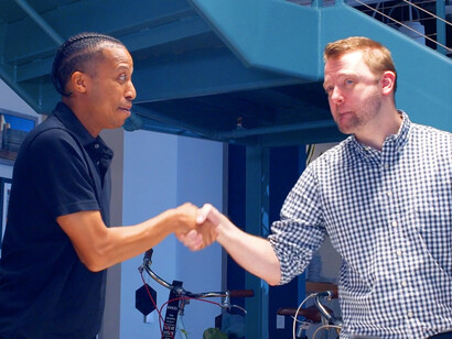 In this moment of connection, we see how effective leadership fosters joy and encourages collaboration among team members