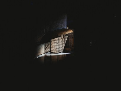 A cage in darkness: photos cage a beautiful moment inside of them