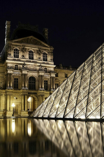 Paris, France, the Louvre Museum at night