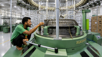 A skilled garment worker carries out specialised production tasks at a clothing factory in Bangladesh, photo by International Labour Organization