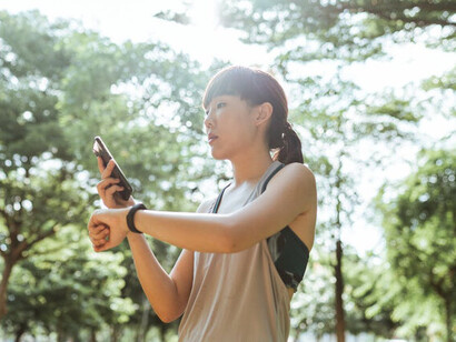 Equipped with her fitness tracker, she's ready to embrace innovation and take her workouts to the next level