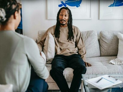 Man looks at his therapist for answers
