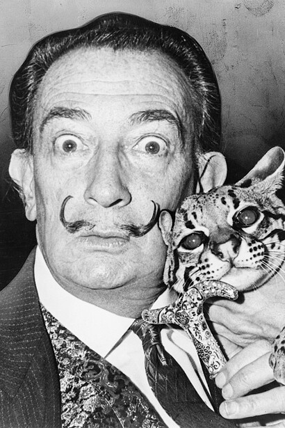 Salvador Dali with his pet ocelot, Babou, and cane