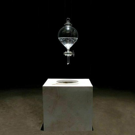 Dove Bradshaw, Waterstone, 1996 to present, Limestone, separatory funnel, water, Limestone: 12 x 12 x 12 inches; 1000 ml separatory funnel