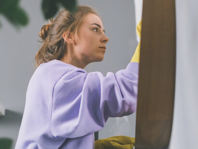 The picture of a woman doing housework highlights the inequality in this regard and the fact that women spend more time on housework than men