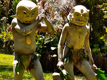 Asaro Mudmen project an eerie presence with masks embodying their tribe's ancient lore and spiritual guardianship